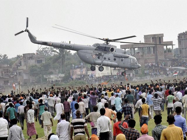 Prime Minister Narendra Modi leaves in a helicopter after NDA's Parivartan Rally in Bihar. Bhagalpur, together with adjoining Seemanchal and Kosi, has been the power house of the 'secular' alliance led by the RJD, Congress and the JD-U. (PTI Photo)
