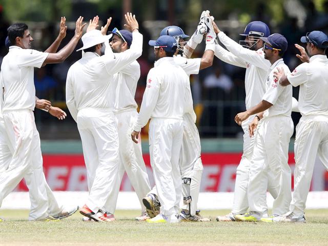 India's Ravichandran Ashwin, left, celebrates the dismissal of Thirimanne with teammates. (Reuters Photo)