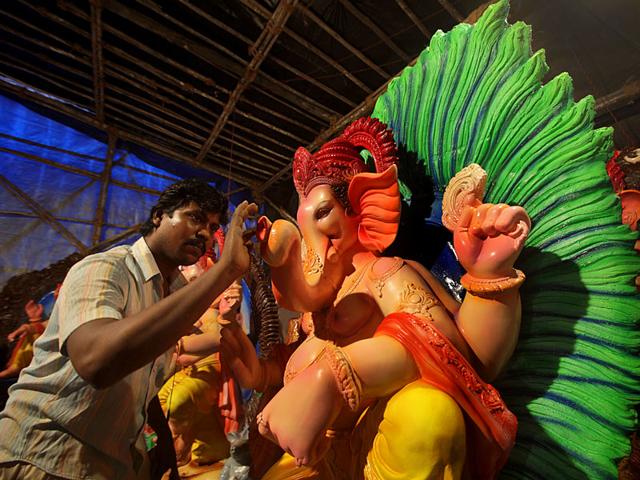 An artisan giving finishing touches to a Ganesh idol at a workshop in Lalbaug. (Kalpak Pathak/HT photo) An artisan giving finishing touches to a Ganesh idol at a workshop in Lalbaug. (Kalpak Pathak/HT photo)