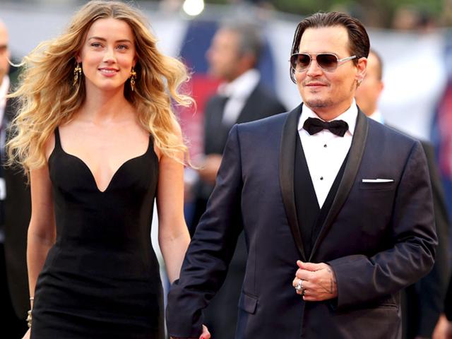 With her flawless figure on full display, Amber stunned in a floor-length black dress, smiling proudly beside her A-Lister husband.