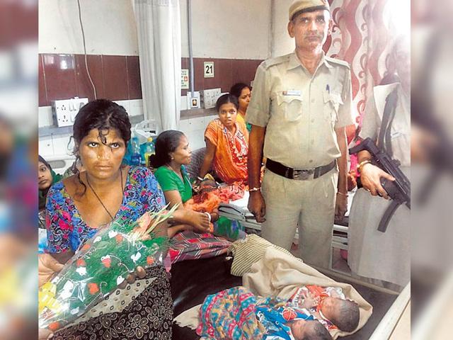 Laxmibai and her twin girls at the hosiptal, with PCR personnel who helped her deliver a baby girl. (Handout Photo) Laxmibai and her twin girls at the hosiptal, with PCR personnel who helped her deliver a baby girl. (Handout Photo)