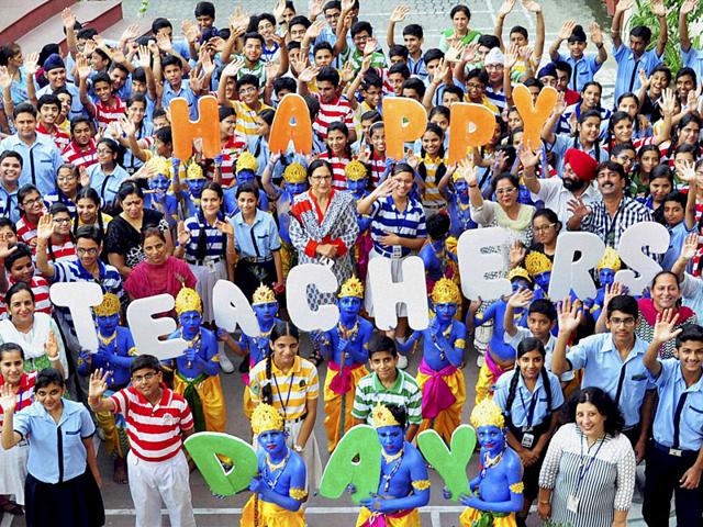 Students and teachers celebrating Teacher's Day and Janmashtami at a school in Ambala Cantt on Friday. (PTI photo) Students and teachers celebrating Teacher's Day and Janmashtami at a school in Ambala Cantt on Friday. (PTI photo)