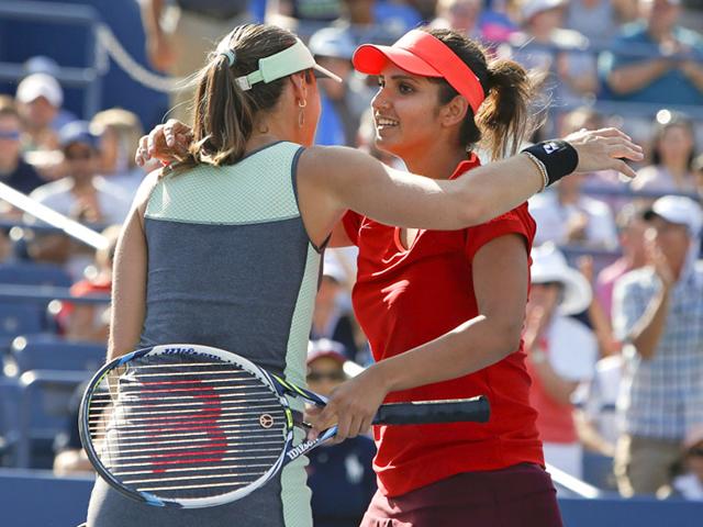 Martina Hingis of Switzerland, left, and partner Sania Mirza, of India, celebrate after winning their doubles match during the fourth round of the US Open. (AP Photo) Martina Hingis of Switzerland, left, and partner Sania Mirza, of India, celebrate after winning their doubles match during the fourth round of the US Open. (AP Photo)