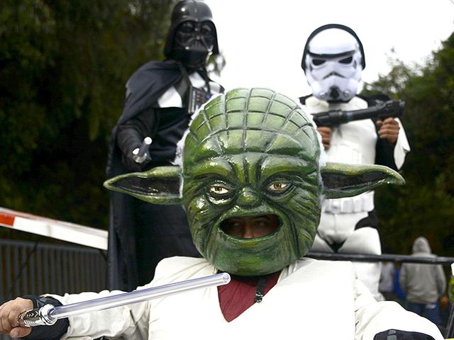Participants depicting Star Wars characters descend a hill in a homemade car during the XXVI Car Festival in Colombia on September 6, 2015. (AFP)