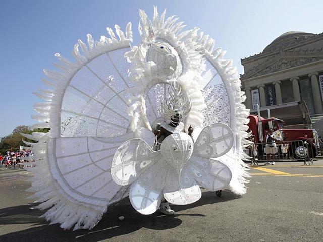 A dancer with D'Midas International Boston marches in the West Indian Day Parade past the Brooklyn Museum September 7, 2015. (AP) A dancer with D'Midas International Boston marches in the West Indian Day Parade past the Brooklyn Museum September 7, 2015. (AP)