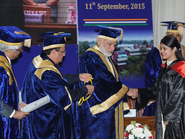 PM Narendra Modi congratulating a doctor during the convocation ceremony of the Post Graduate Institute of Medical Education and Research in Chandigarh on Friday (Keshav Singh/HT)