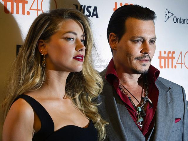 Johnny Depp and his wife Amber Heard arrive for the premiere of Black Mass at the Toronto International Film Festival. (Reuters)