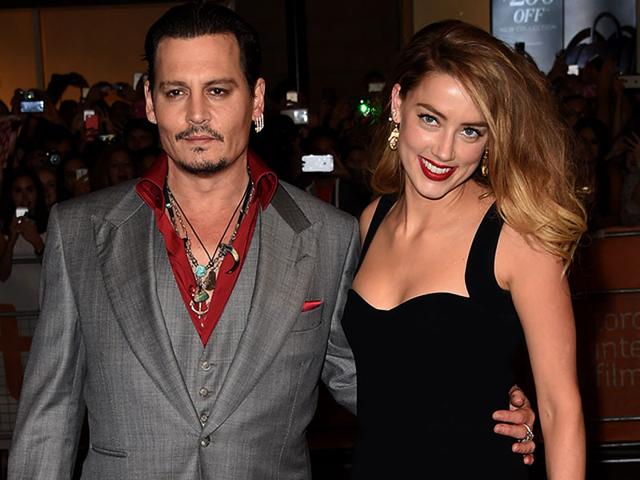 Johnny Depp and his wife arrive for the premiere of Black Mass at TIFF. (Reuters)