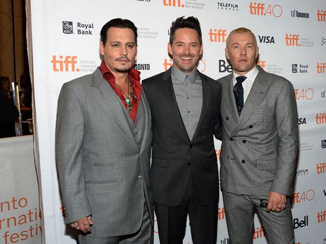 Johnny Depp, co-star Joel Edgerton and director Scott Cooper (centre) at the Toronto International Film Festival premiere of Black Mass. (AP)