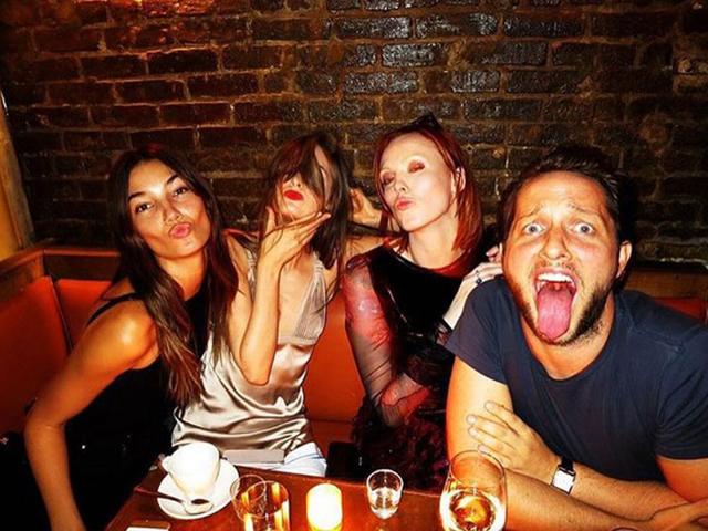 Off-duty catwalkers Lily Aldridge, Karen Elson and Laura Love let their hair down by mixing up their poses with writer Derek Blasberg. (Instagram)