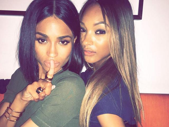Topshop's new ambassador Ciara snuggles up to model Jourdan Dunn at a dinner thrown by the label. (Instagram)