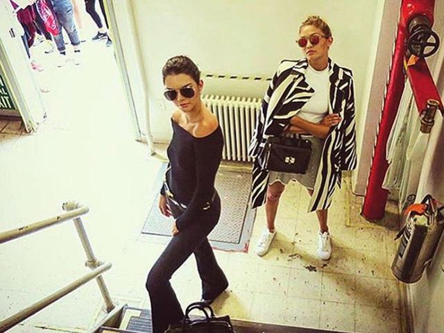 Fashion critic Derek Blasberg directs supermodels Kendall Jenner and Gigi Hadid in what looks to be an impromptu stairway photo shoot. (Instagram)