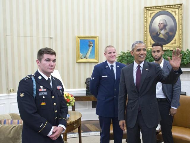 US President Barack Obama waves at a reporter watched by US Army Specialist Alek Skarlatos (L), US Air Force Airman 1st Class Spencer Stone (2nd L), and Anthony Sadler (R) following a meeting on September 17, 2015 in the Oval Office of the White House in Washington, DC. (AFP) US President Barack Obama waves at a reporter watched by US Army Specialist Alek Skarlatos (L), US Air Force Airman 1st Class Spencer Stone (2nd L), and Anthony Sadler (R) following a meeting on September 17, 2015 in the Oval Office of the White House in Washington, DC. (AFP)