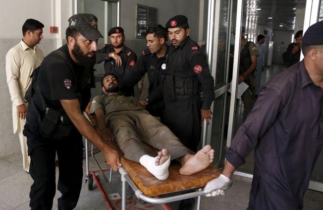 Emergency workers wheel an injured man to a hospital after the attack in Peshawar. (REUTERS) Emergency workers wheel an injured man to a hospital after the attack in Peshawar. (REUTERS)