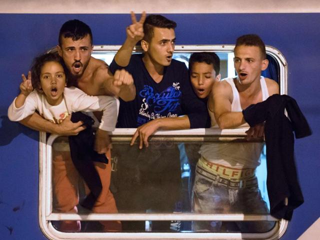 Migrants react as they wait in a train near the Slovenian-Croatian border seeking a new route into Europe's borderless Schengen area, after Hungary fenced off its own border with Serbia. (AFP) Migrants react as they wait in a train near the Slovenian-Croatian border seeking a new route into Europe's borderless Schengen area, after Hungary fenced off its own border with Serbia. (AFP)