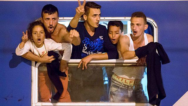 Migrants react as they wait in a train near the Slovenian-Croatian border seeking a new route into Schengen , after neighbouring Hungary fenced off its own border with Serbia. (AFP) Migrants react as they wait in a train near the Slovenian-Croatian border seeking a new route into Schengen , after neighbouring Hungary fenced off its own border with Serbia. (AFP)