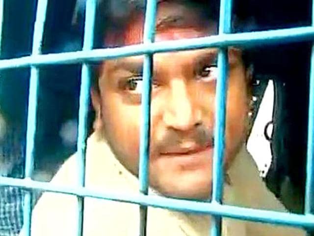Hardik Patel inside a police van in Surat (AN I Photo) Hardik Patel inside a police van in Surat (AN I Photo)
