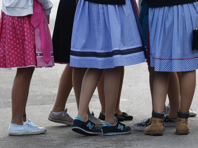 Young girls dressed in the traditional attire at the opening of the Oktoberfest beer festival . (AP)