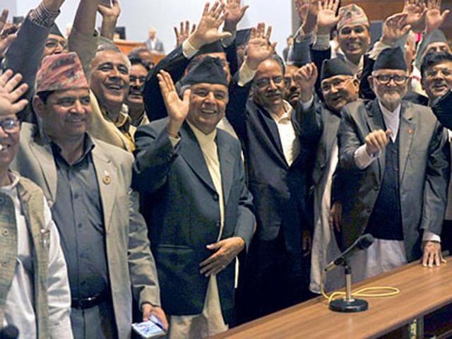 Nepal Prime Minister Sushil Koirala (3R),Unified Marxist Leninist chairman K P Oli (4R), Nepalese Unified Communist Party of Nepal (Maoist) chairman Pushpa Kamal Dahal, known better as Prachanda (4L) and other lawmakers wave while Nepal’s parliament passes a new national constitution in Kathmandu. (AFP Photo) Nepal Prime Minister Sushil Koirala (3R),Unified Marxist Leninist chairman K P Oli (4R), Nepalese Unified Communist Party of Nepal (Maoist) chairman Pushpa Kamal Dahal, known better as Prachanda (4L) and other lawmakers wave while Nepal’s parliament passes a new national constitution in Kathmandu. (AFP Photo)