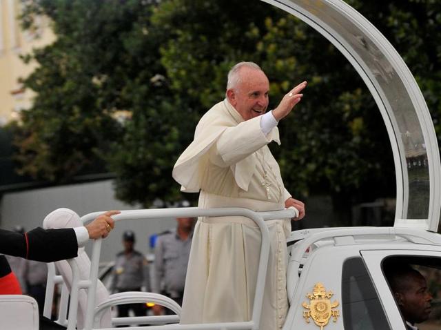Pope Francis (left) waves next to Cuban President Raul Castro upon his arrival at Jose Marti international airport in Havana . (AFP) Pope Francis (left) waves next to Cuban President Raul Castro upon his arrival at Jose Marti international airport in Havana . (AFP)