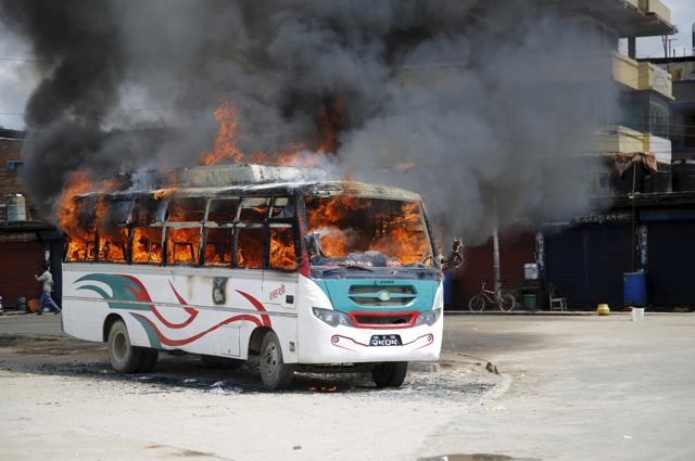 A passenger bus set on fire by unidentified protesters is pictured during the nationwide strike, called by the opposition parties against the proposed constitution, in Kathmandu, Nepal. (Reuters Photo) A passenger bus set on fire by unidentified protesters is pictured during the nationwide strike, called by the opposition parties against the proposed constitution, in Kathmandu, Nepal. (Reuters Photo)