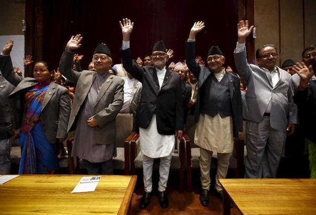 Nepal's Prime Minister Sushil Koirala (C), is seen along with other leaders after signing the copy of constitution at the parliament in Kathmandu, Nepal . (Reuters) Nepal's Prime Minister Sushil Koirala (C), is seen along with other leaders after signing the copy of constitution at the parliament in Kathmandu, Nepal . (Reuters)
