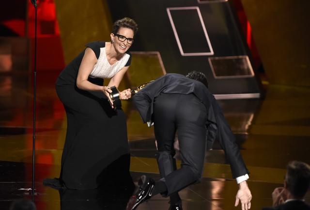 Tina Fey laughs as Jon Hamm makes it to the stage. (AP) Tina Fey laughs as Jon Hamm makes it to the stage. (AP)