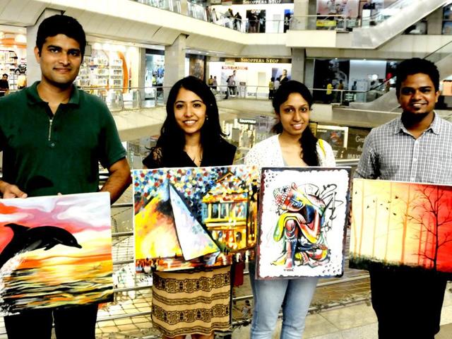 Several students of IIM-Lucknow flocked to Fun Republic Mall on Sunday and sold their paintings to help the girl child. The exercise was also aimed at helping students learn the art of negotiation. Lucknowites happily opened their wallets for amateur paintings made by budding managers. (Deepak Gupta/HT) 