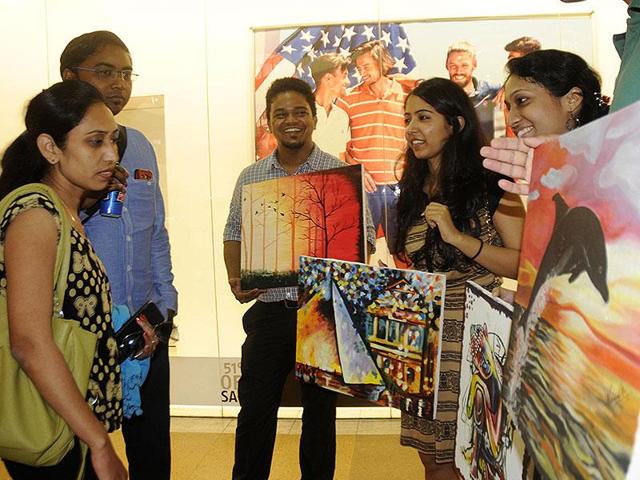 Several students of IIM-Lucknow flocked to Fun Republic Mall on Sunday and sold their paintings to help the girl child. The exercise was also aimed at helping students learn the art of negotiation. Lucknowites happily opened their wallets for amateur paintings made by budding managers. (Deepak Gupta/HT) 
