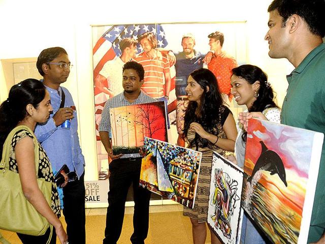 Several students of IIM-Lucknow flocked to Fun Republic Mall on Sunday and sold their paintings to help the girl child. The exercise was also aimed at helping students learn the art of negotiation. Lucknowites happily opened their wallets for amateur paintings made by budding managers. (Deepak Gupta/HT) 