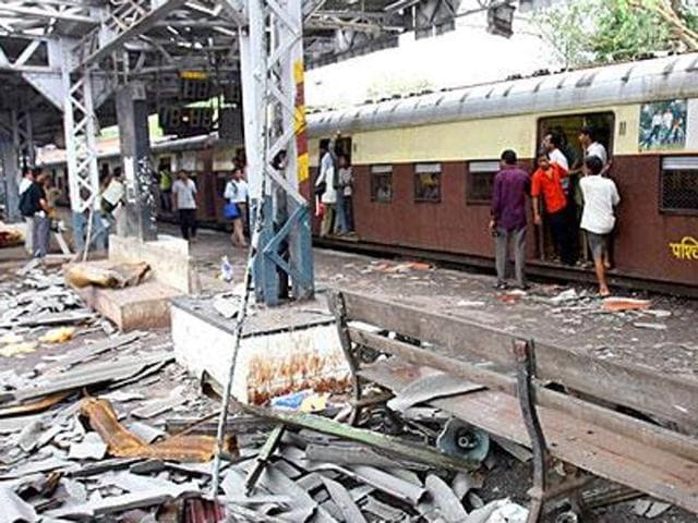 In this file photograph taken on July 12, 2006, commuters walk past the blast site at Mahim railway station in Mumbai, the day after a wave of coordinated blasts on commuter trains in Mumbai. (AFP file photo) In this file photograph taken on July 12, 2006, commuters walk past the blast site at Mahim railway station in Mumbai, the day after a wave of coordinated blasts on commuter trains in Mumbai. (AFP file photo)
