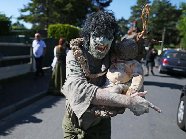 Fantasy-enthusiasts dressed as ghoulish creatures attend the Cidre et Dragon (Cider and Dragon) fantasy festival on September 20, 2015 in Merville-Franceville-Plage, northwest France. (AFP) 