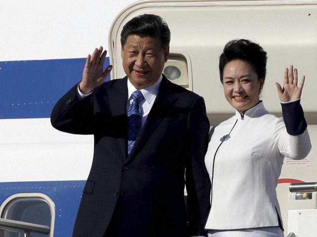 Chinese President Xi Jinping, left, and his wife Peng Liyuan wave upon arriving in Seattle. (AP Photo) Chinese President Xi Jinping, left, and his wife Peng Liyuan wave upon arriving in Seattle. (AP Photo)
