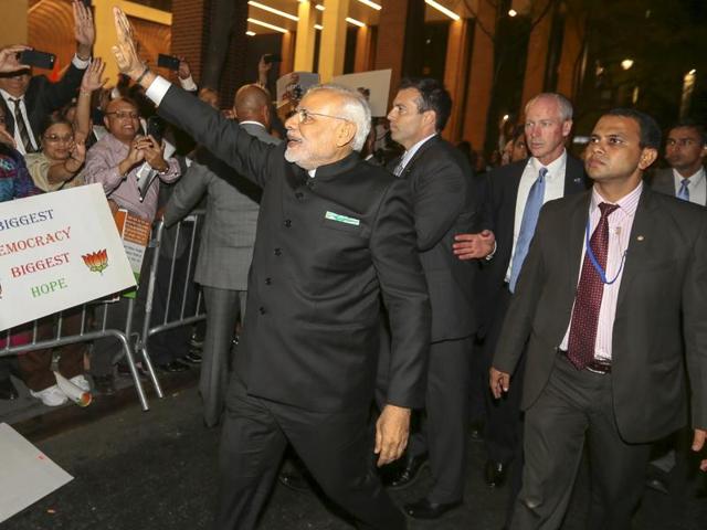 Prime Minister Narendra Modi waves to well wishers after arriving at his hotel ahead of the 2015 general assembly of the United Nations in Manhattan, New York . Tech titans will also court Modi in Silicon Valley this weekend. (Reuters Photo) Prime Minister Narendra Modi waves to well wishers after arriving at his hotel ahead of the 2015 general assembly of the United Nations in Manhattan, New York . Tech titans will also court Modi in Silicon Valley this weekend. (Reuters Photo)
