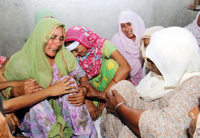 Villagers consoling the mother and wife of farmer Kuldeep Singh, who committed suicide allegedly over crop loss, at Chuge Kalan village in Bathinda on Thursday. (Sanjeev Kumar/HT) Villagers consoling the mother and wife of farmer Kuldeep Singh, who committed suicide allegedly over crop loss, at Chuge Kalan village in Bathinda on Thursday. (Sanjeev Kumar/HT)