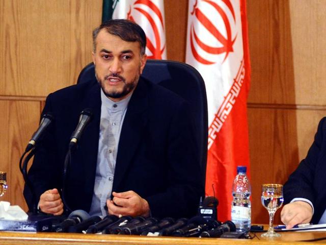 Iran's Deputy Foreign Minister Hossein Amir Abdollahian, left, sits next to his Syrian counterpart Faisal Mekdad, right. (SANA via AP) Iran's Deputy Foreign Minister Hossein Amir Abdollahian, left, sits next to his Syrian counterpart Faisal Mekdad, right. (SANA via AP)