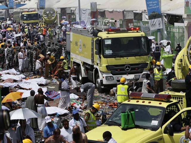 Saudi emergency services move among the bodies of those killed in the stampede in the Mina neighbourhood of Mecca. These pilgrims were on a pilgrimage to observe one of the stages of haj. (EPA)