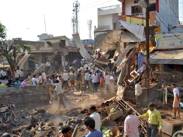People stand near the site of an explosion in Jhabua district at Madhya Pradesh. (Reuters Photos)