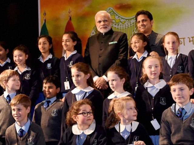 Prime Minister Narendra Modi in a group photo with the children who performed during his interaction with the Indian community in Dublin. (PTI Photo) Prime Minister Narendra Modi in a group photo with the children who performed during his interaction with the Indian community in Dublin. (PTI Photo)
