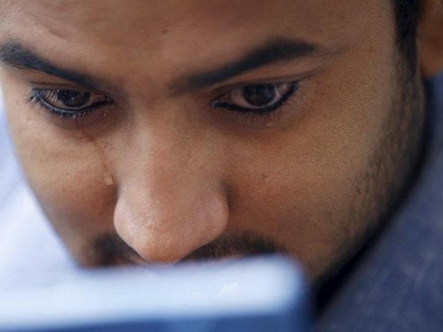 Tears roll down the eyes of a Nepali Muslim man after applying kohl on his eyelid during the Eid al-Adha celebrations at the Kashmiri Takiya Jame mosque in Kathmandu, Nepal. (REUTERS)