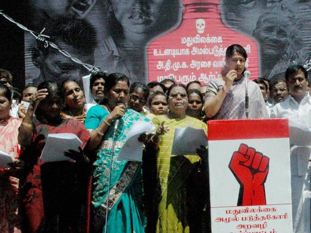 DMK chief M Karunanidhi's daughter and Rajya Sabha MP Kanimozhi along with party workers during a protest against Tamil Nadu State Marketing Corporation(TASMAC) over the alcohol sale in the state in Chennai. (PTI) DMK chief M Karunanidhi's daughter and Rajya Sabha MP Kanimozhi along with party workers during a protest against Tamil Nadu State Marketing Corporation(TASMAC) over the alcohol sale in the state in Chennai. (PTI)
