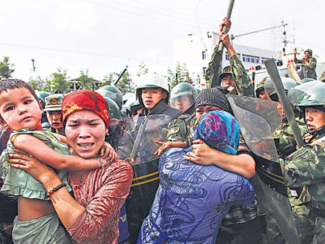 Civilians of China’s conflict ridden Xinjiang province during tensions in the region. (HT File Photo) Civilians of China’s conflict ridden Xinjiang province during tensions in the region. (HT File Photo)