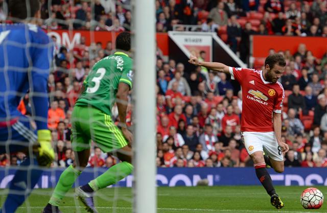 Juan Mata, right, shoots United’s third goal past Sunderland's Romanian goalkeeper Costel Pantilimon, left. (AFP Photo) Juan Mata, right, shoots United’s third goal past Sunderland's Romanian goalkeeper Costel Pantilimon, left. (AFP Photo)