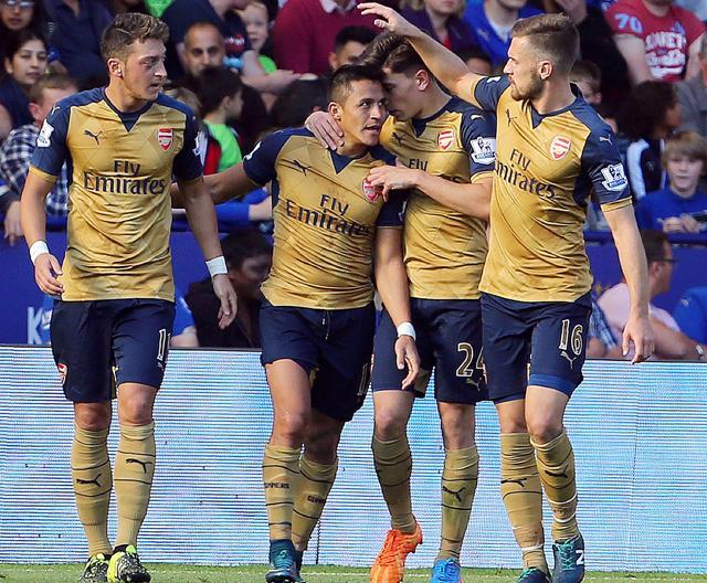 Arsenal’s Chilean striker Alexis Sanchez, second from left, celebrates after scoring his team's third goal during the EPL match against Leicester City at King Power Stadium in Leicester, on September 26, 2015. (AFP Photo) Arsenal’s Chilean striker Alexis Sanchez, second from left, celebrates after scoring his team's third goal during the EPL match against Leicester City at King Power Stadium in Leicester, on September 26, 2015. (AFP Photo)