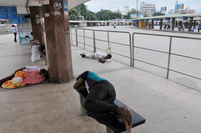 People sleeping at a bus stand in Bengaluru during Karnataka bandh on Saturday. (PTI photo) People sleeping at a bus stand in Bengaluru during Karnataka bandh on Saturday. (PTI photo)