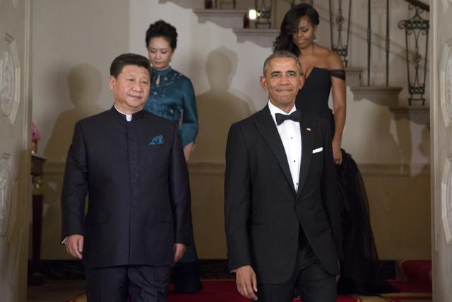 President Barack Obama, Chinese President Xi Jinping, first lady Michelle Obama and Jinping's wife Peng Liyuan descend the Grand Staircase as they arrive for a State Dinner at the White House in Washington. (AP Photo) President Barack Obama, Chinese President Xi Jinping, first lady Michelle Obama and Jinping's wife Peng Liyuan descend the Grand Staircase as they arrive for a State Dinner at the White House in Washington. (AP Photo)