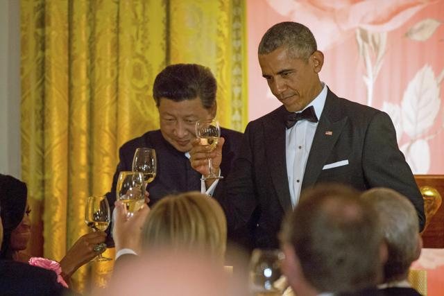 Chinese President Xi Jinping and President Barack Obama toast with first lady Michelle Obama during a State Dinner, in the East Room of the White House in Washington. (AP Photo) Chinese President Xi Jinping and President Barack Obama toast with first lady Michelle Obama during a State Dinner, in the East Room of the White House in Washington. (AP Photo)