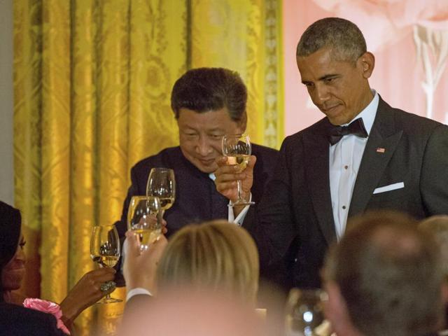 Chinese President Xi Jinping and President Barack Obama toast with first lady Michelle Obama during a State Dinner in the East Room of the White House in Washington. (AP Photo) Chinese President Xi Jinping and President Barack Obama toast with first lady Michelle Obama during a State Dinner in the East Room of the White House in Washington. (AP Photo)