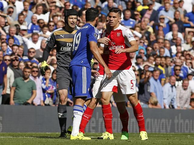 Chelsea's Diego Costa clashes with Arsenal's Gabriel Paulista. (REUTERS) Chelsea's Diego Costa clashes with Arsenal's Gabriel Paulista. (REUTERS)