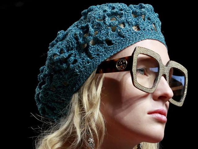 Tortoise-shell glasses and voluminous blow-outs brought ‘geek chic’ back into focus at Gucci. (REUTERS)